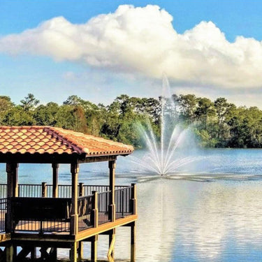Vertex TriTier Floating Fountain In Front Of A Wooden Deck